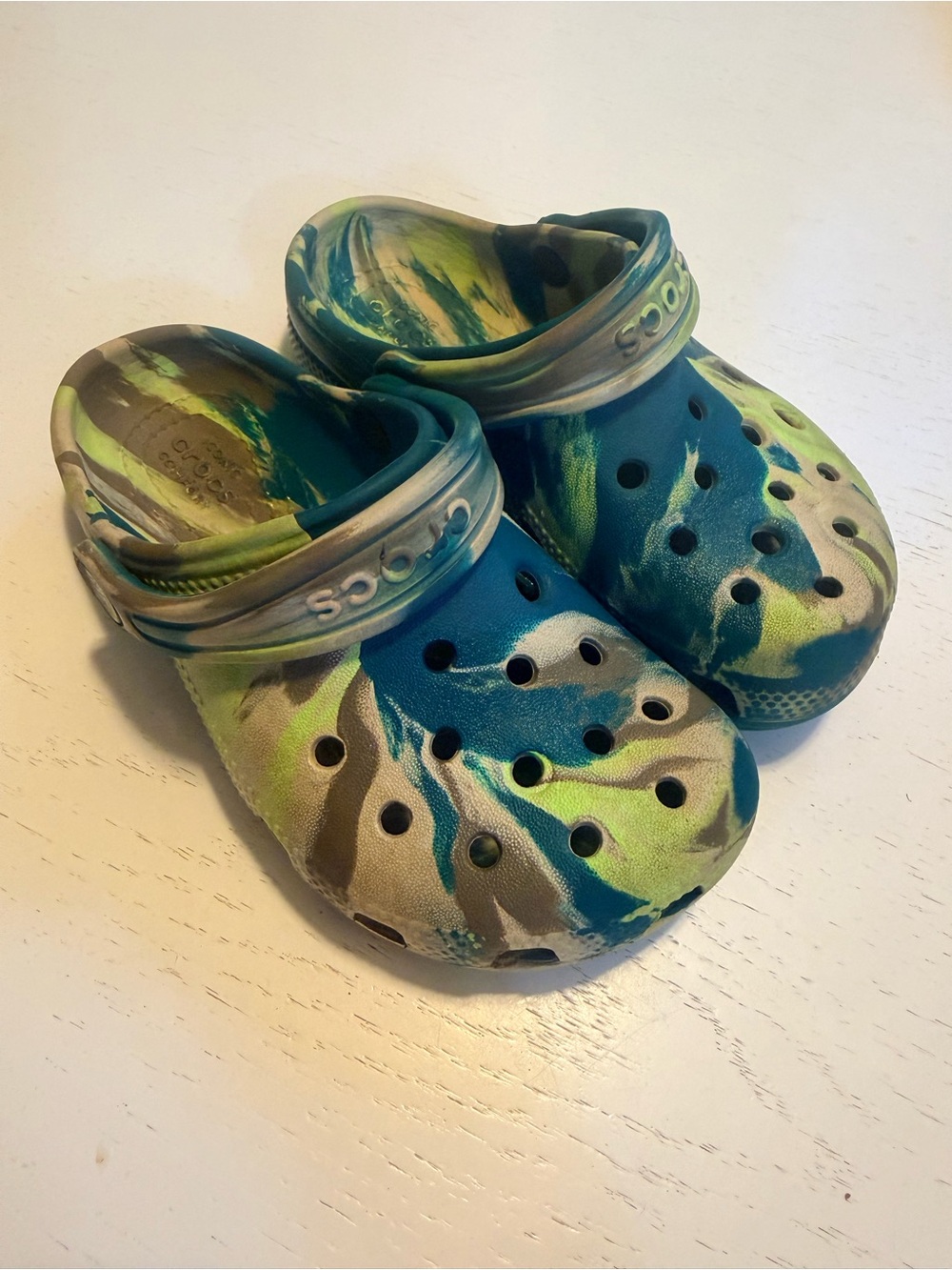 Kids Crocs Slip-On Clogs in Blue & Green swirl pattern